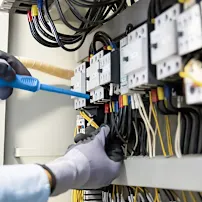 Engineer inspecting electrical box ensuring everything is up and running.