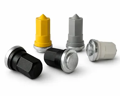 Different types of Tucker grounding studs with black, yellow and grey plastic caps on white background.