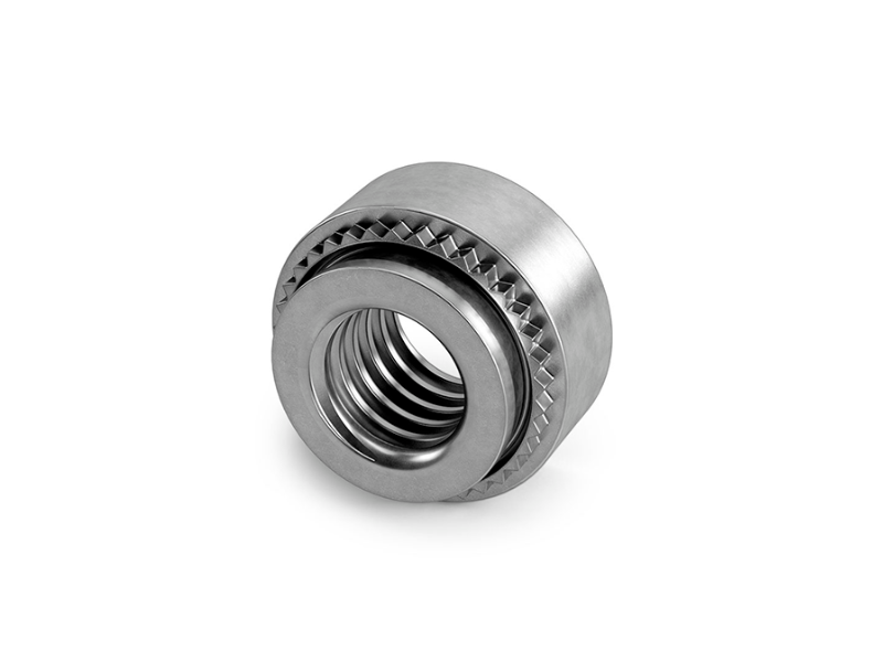 A self-clinching-nut on a white background.