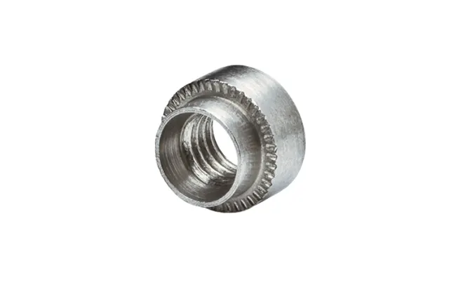 Close-up of a metal PEM self-clinching nut, round type, on white background