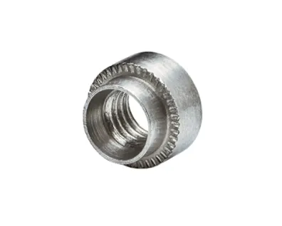 Close-up of a metal PEM self-clinching nut, round type, on white background