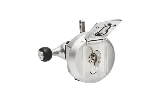 Close-up of a silver colored Dirak compression latch with open lock cover