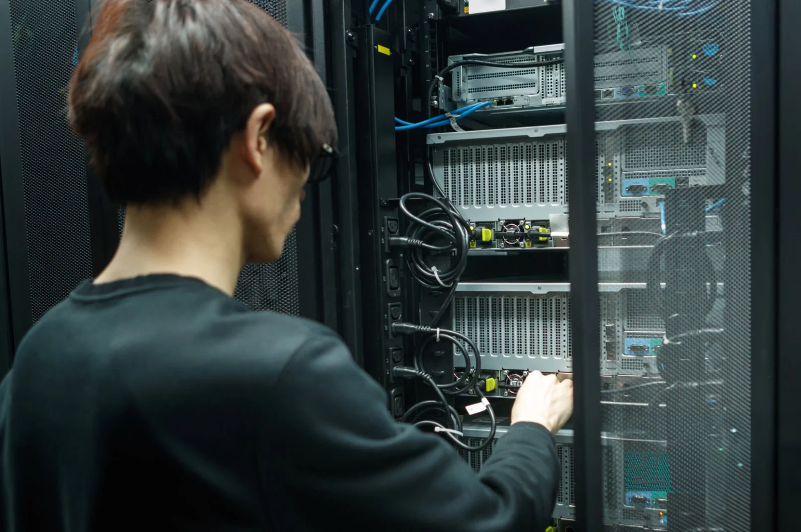 A man working with high performance data center computer