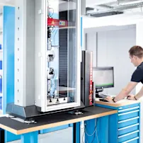Engineer is conducting a tensile strength test in a technical test lab.