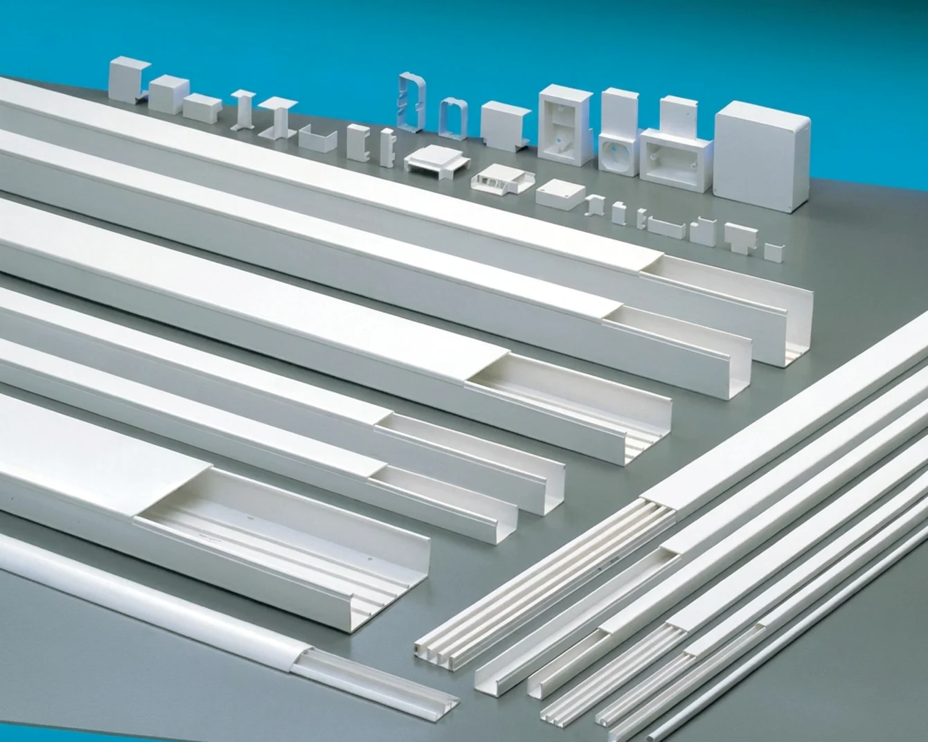 Overview of different Elettrocanali cable trunking solutions on grey and blue background.