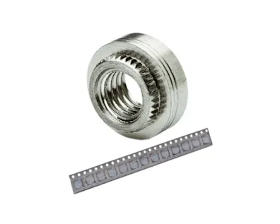 A PEM self-clinching nut and a taped PEM SMT nut strip, designed especially for PC board mounting