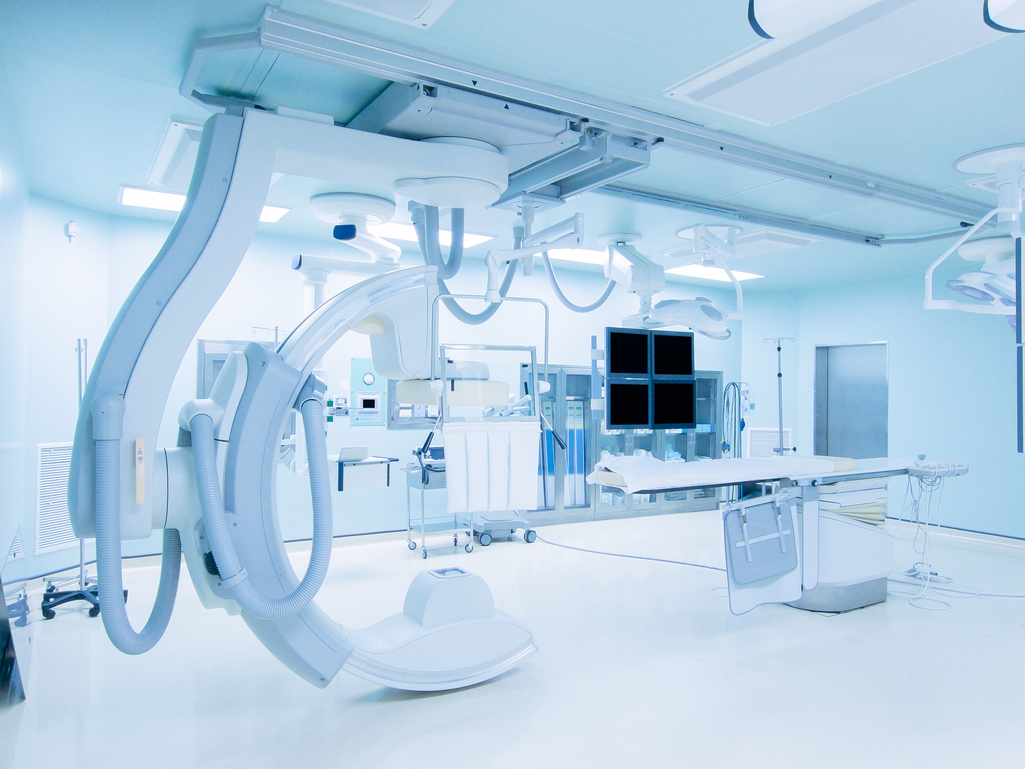 Complicated medical devices in a room.