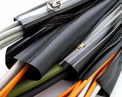 Reiku cable management system with black sheathing and multiple colored cables including orange, green, and white wires.