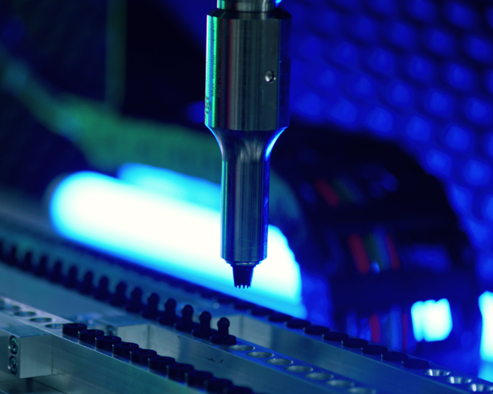 High-tech ultrasonic welding process machine for electric vehicle components.