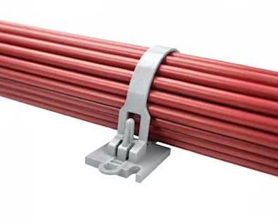 Gray plastic cable tie securing a bundle of red electrical wires or cables against a white background.