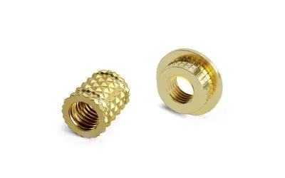 Lightweight threaded inserts and thermoplastic housing on white background