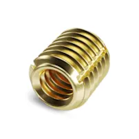 A brass Tappex Trisert threaded insert on white background
