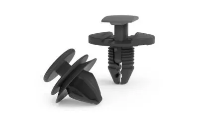 A set of plastic trim clips and push fasteners on white background