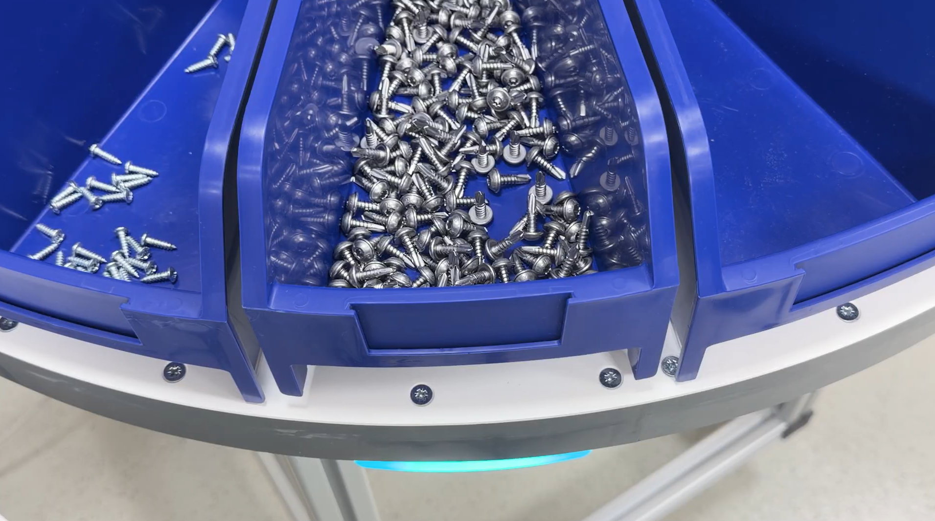 Close-up of blue Bossard SmartTower bins with screws inside
