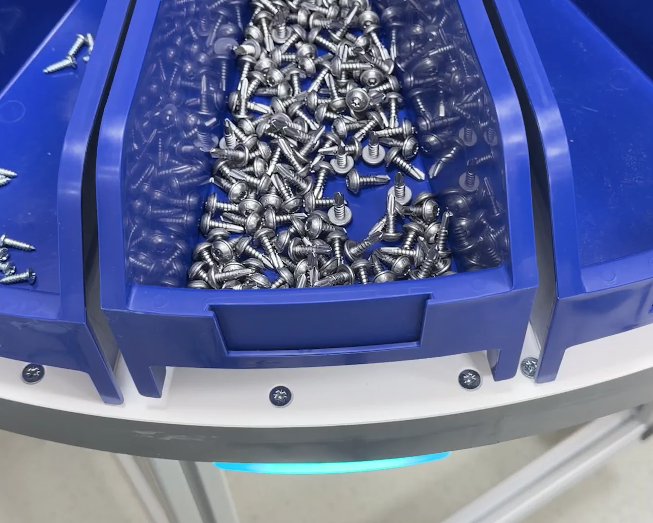 Close-up of blue Bossard SmartTower bins with screws inside
