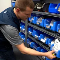 Bossard Smart Factory Logistics Specialist restocking and maintaining SmartBins