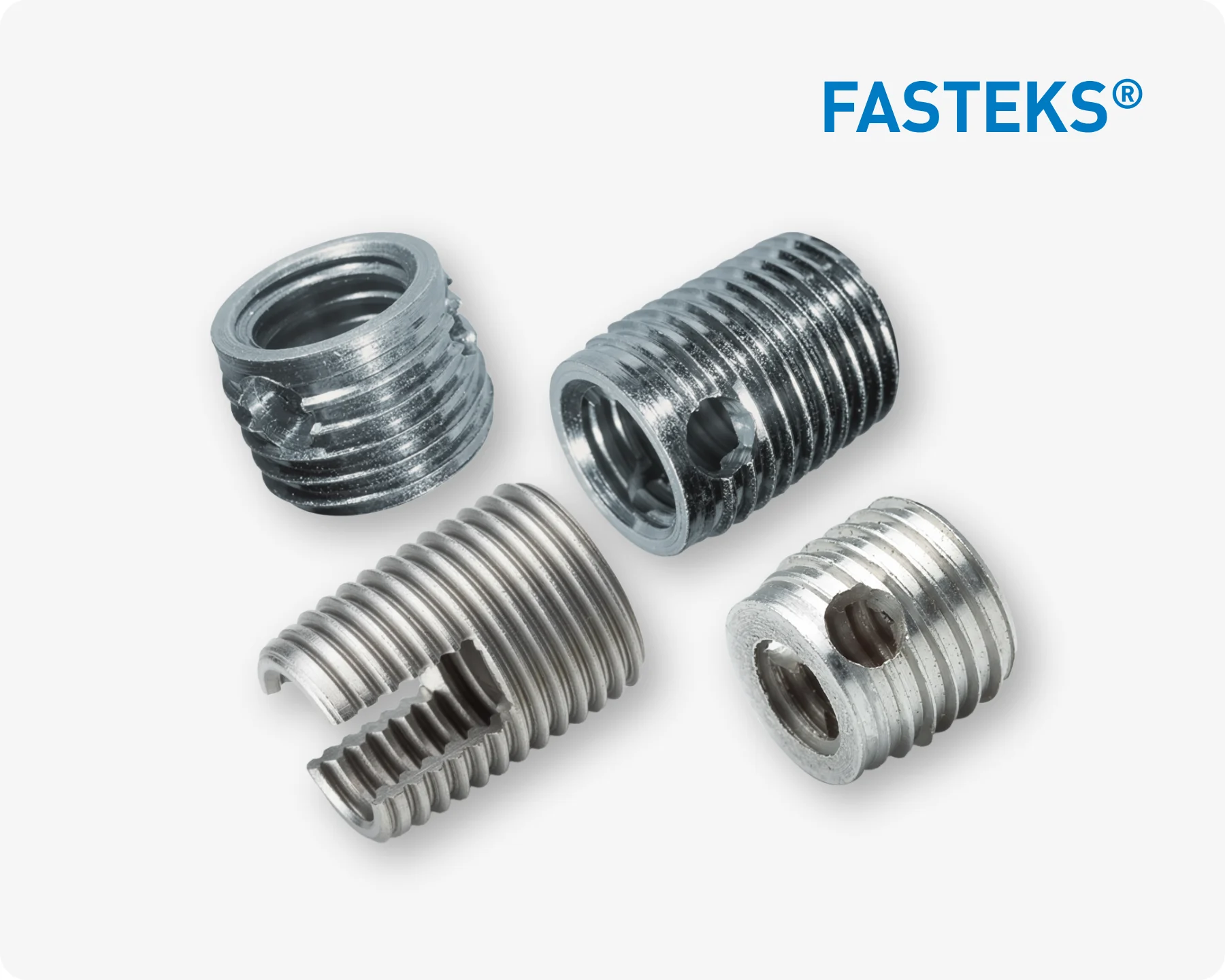 Four silver FASTEKS metal threaded inserts in different shapes on a white background with FASTEKS logo.