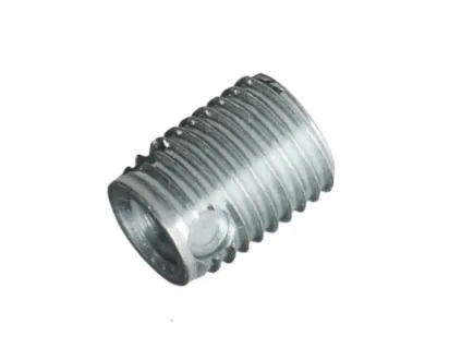 Silver FASTEKS metal threaded insert with side hole and chip reservoir on a white background.