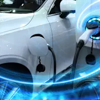 Electric vehicle charging with futuristic light effects, representing expert eMobility solutions.