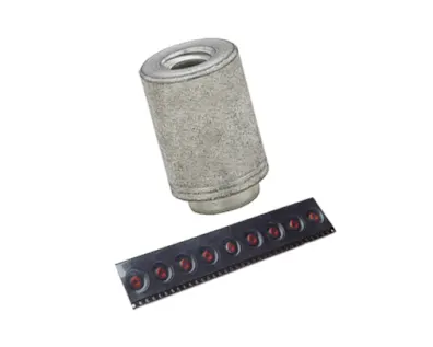 A PEM spacer and a strip of taped PEM SMT Spacers, designed for PC board mounting, on white background
