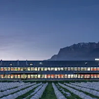 Integra building at dusk with mountains in the background