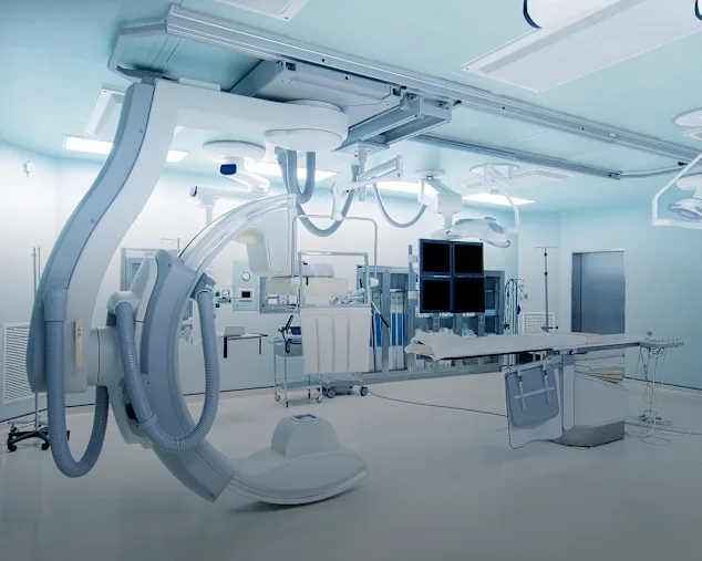 Complicated medical devices in a room.