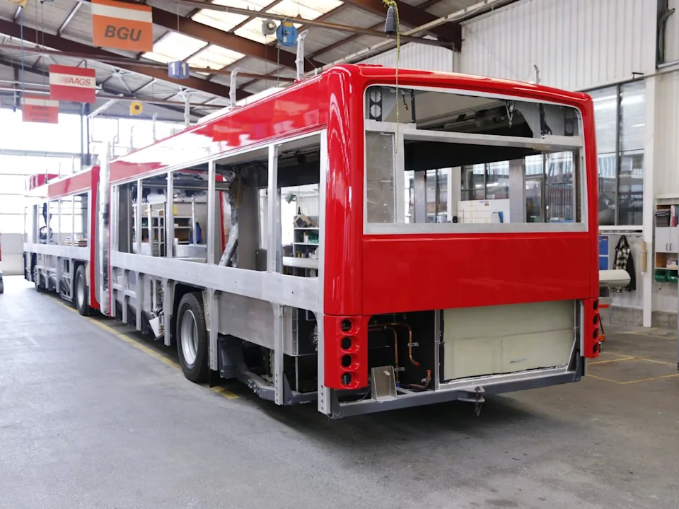 Red bus under construction