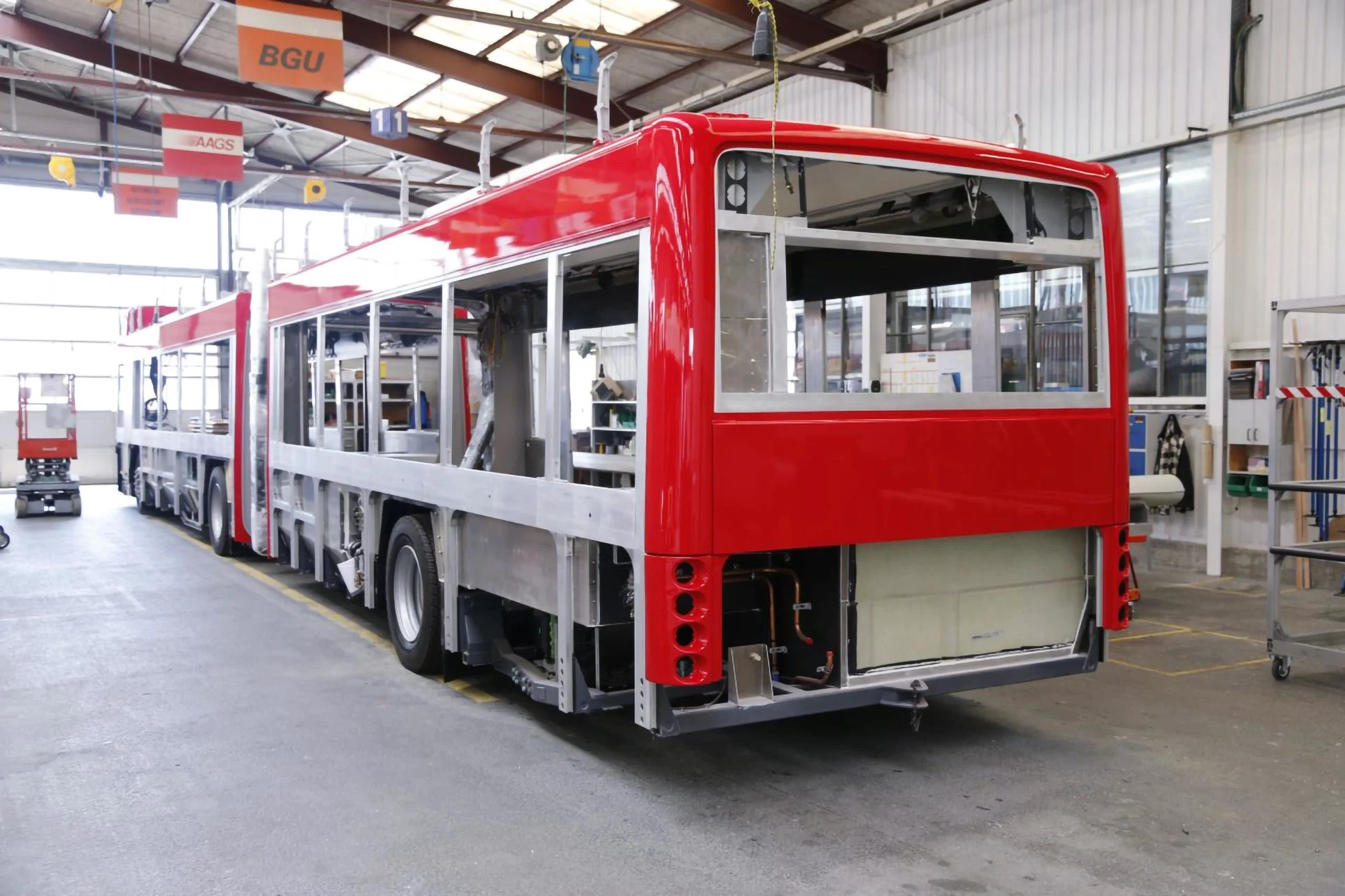 Red bus under construction